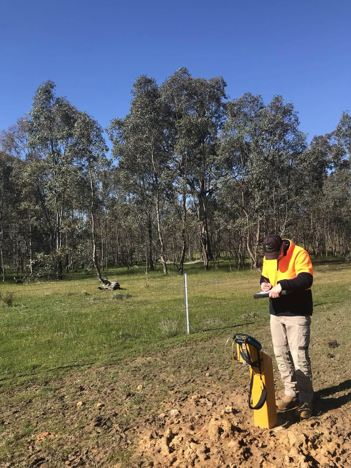 Environmental scientist sampling a groundwater monitoring bore on a site in regional NSW